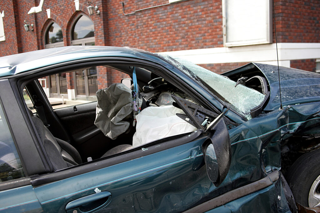 One killed in multi-vehicle crash in Los Angeles that causes a car to crash into a building.
